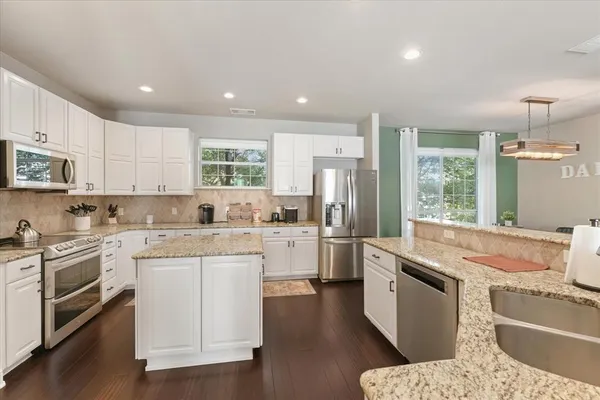 a view of a dining room with furniture window and outside view