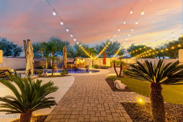 a living room with furniture and large windows