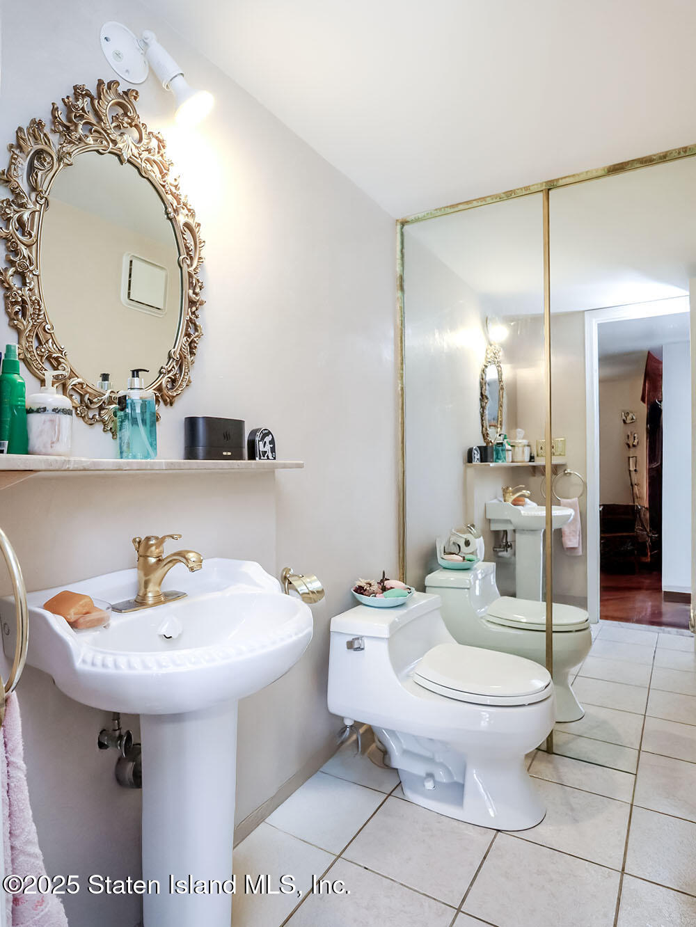 45 Fairlawn Loop Staten Island, NY 10308 - Photo 13 of 49 a bathroom with a sink a toilet and a mirror