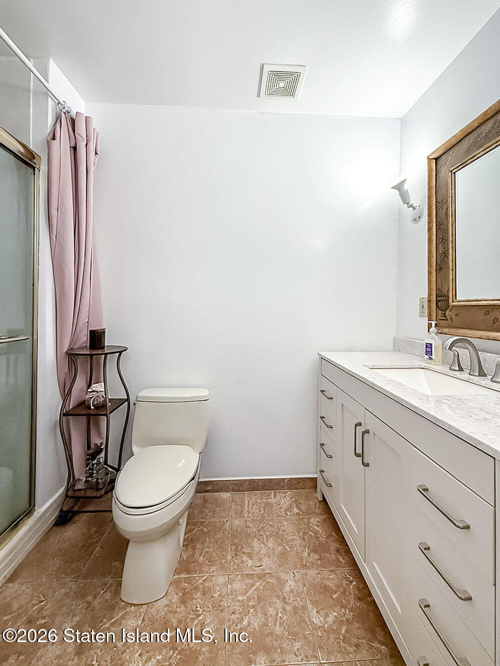 45 Fairlawn Loop Staten Island, NY 10308 - Photo 18 of 49 a bathroom with a sink toilet and shower