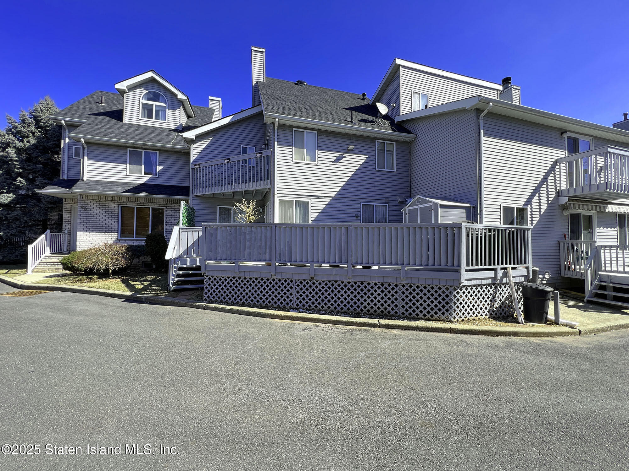 45 Fairlawn Loop Staten Island, NY 10308 - Photo 2 of 49 a view of a car park in front of a house