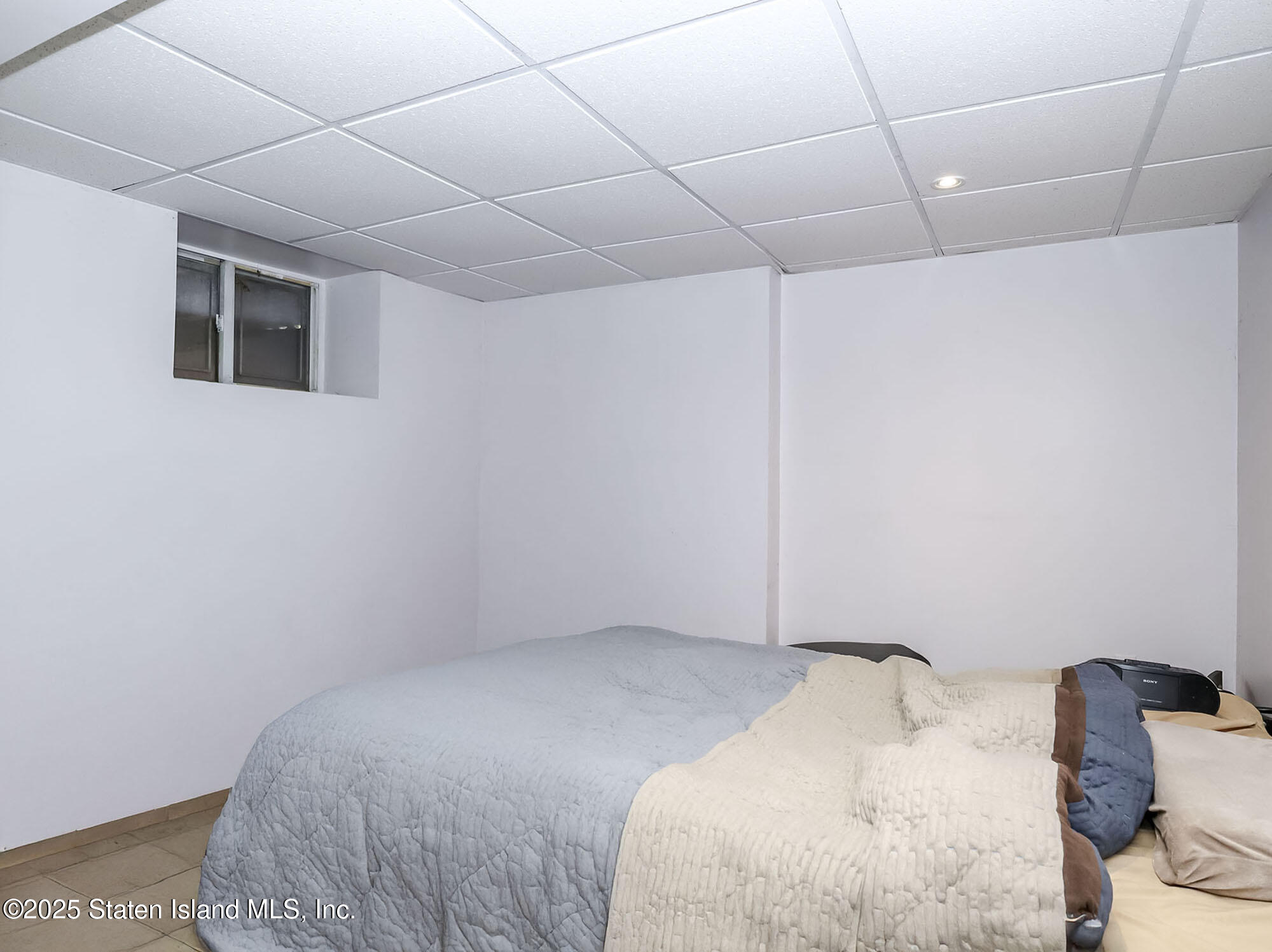 45 Fairlawn Loop Staten Island, NY 10308 - Photo 30 of 49 a bedroom with a bed and a window in it