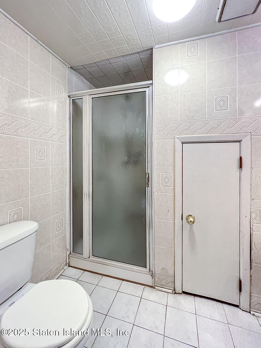 45 Fairlawn Loop Staten Island, NY 10308 - Photo 32 of 49 a bathroom with a toilet and a shower