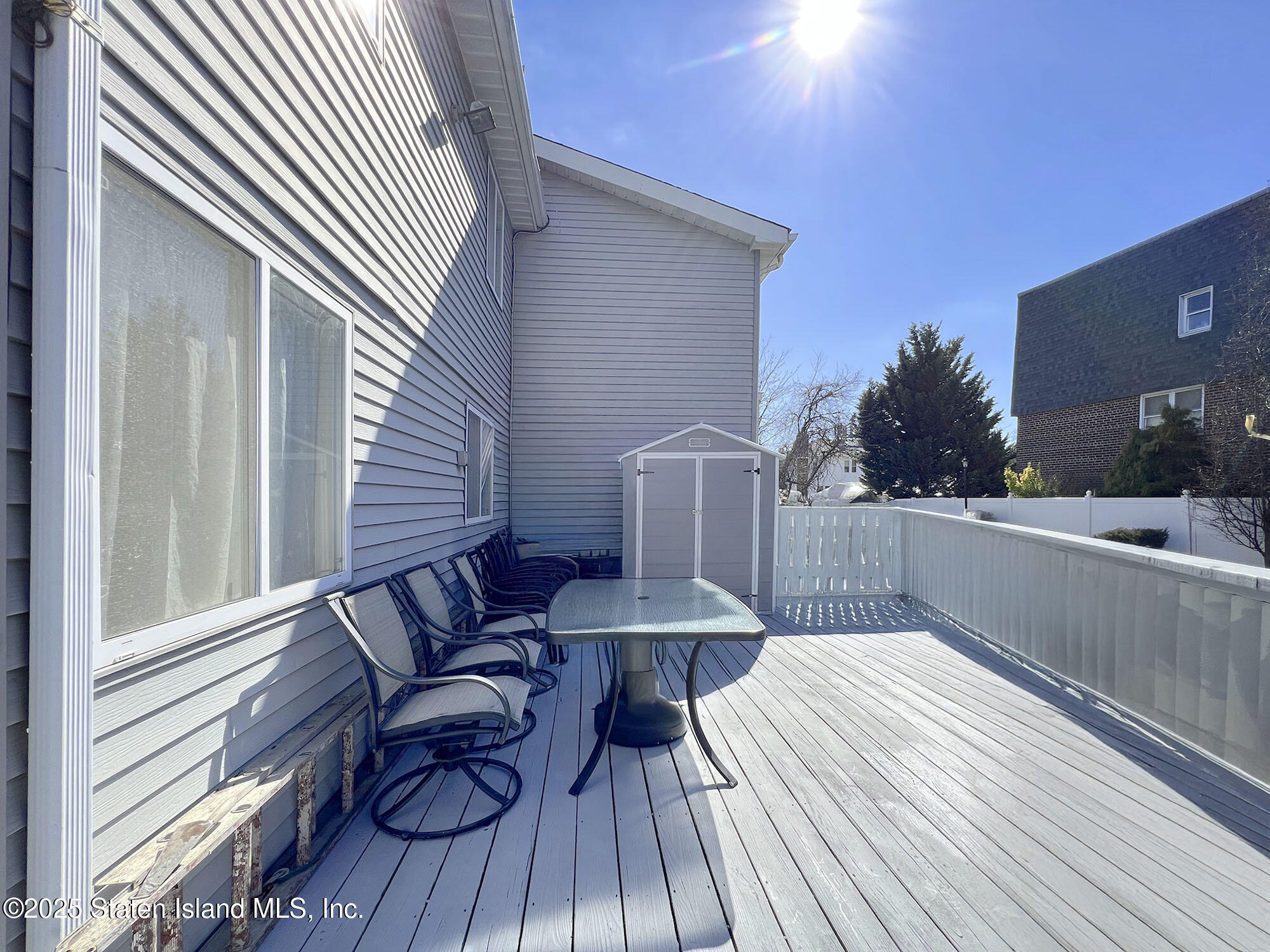 45 Fairlawn Loop Staten Island, NY 10308 - Photo 35 of 49 a view of balcony with wooden floor and seating space