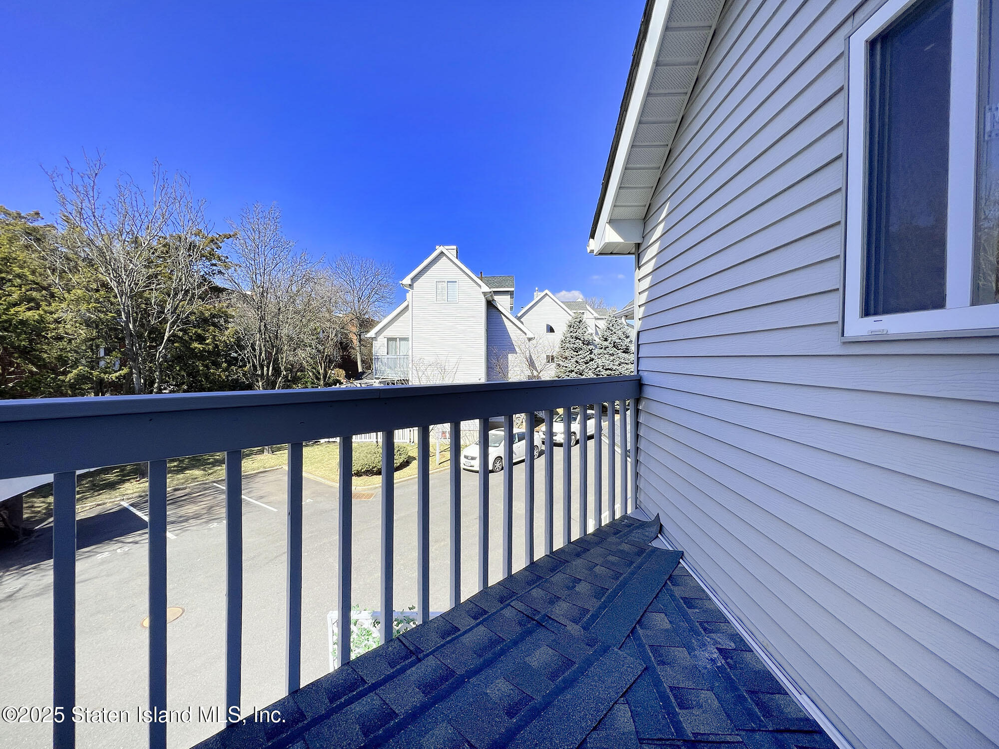 45 Fairlawn Loop Staten Island, NY 10308 - Photo 36 of 49 a view of a balcony with wooden fence and floor