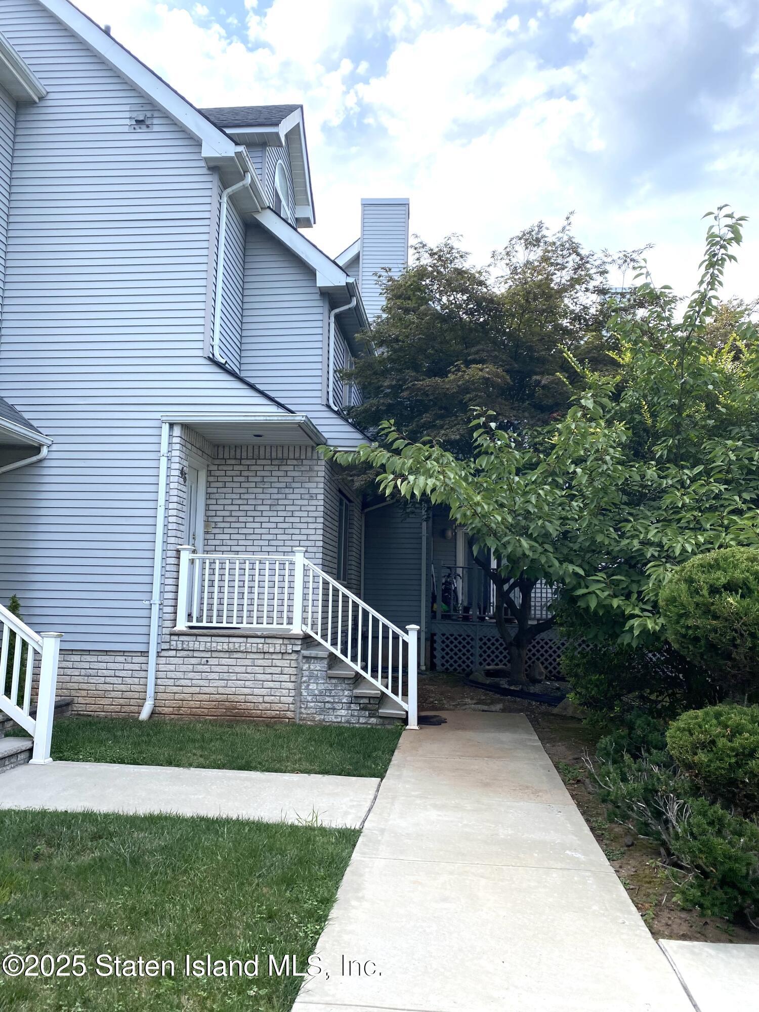 45 Fairlawn Loop Staten Island, NY 10308 - Photo 43 of 49 a view of a house with a yard