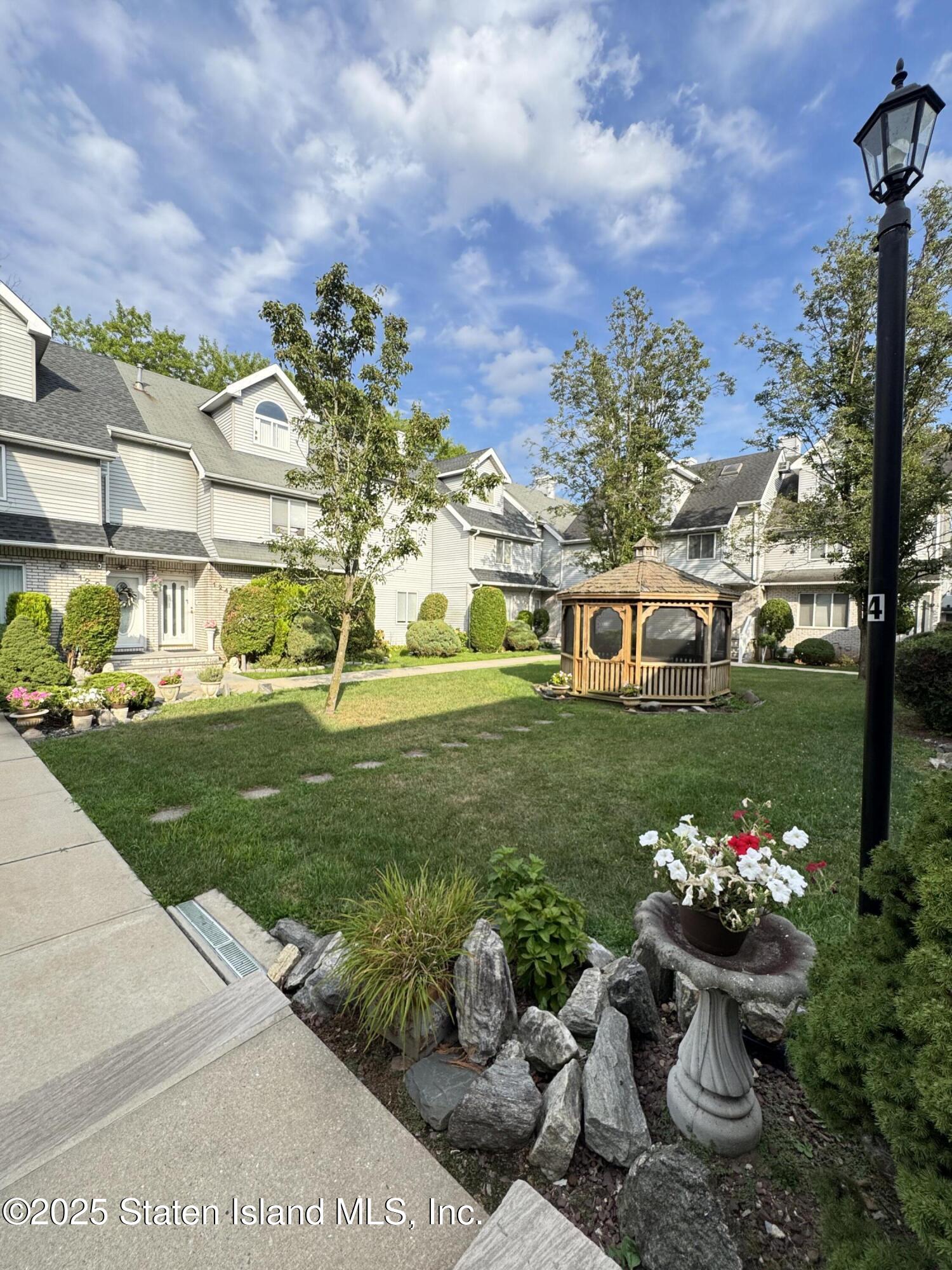 45 Fairlawn Loop Staten Island, NY 10308 - Photo 49 of 49 a view of a house with a yard and garden