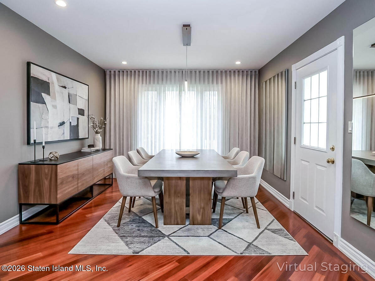 45 Fairlawn Loop Staten Island, NY 10308 - Photo 5 of 49 a view of a dining room with furniture window and wooden floor