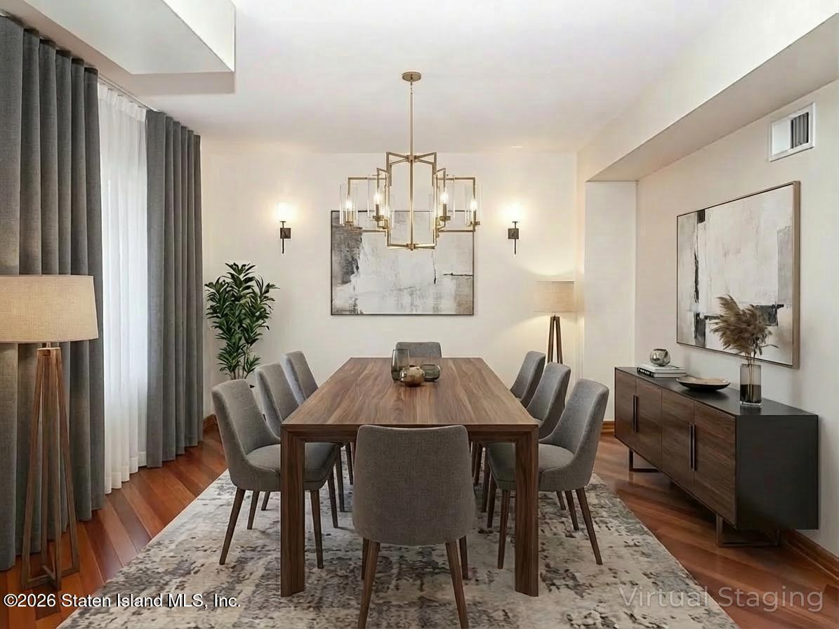 45 Fairlawn Loop Staten Island, NY 10308 - Photo 9 of 49 a view of a dining room with furniture and window
