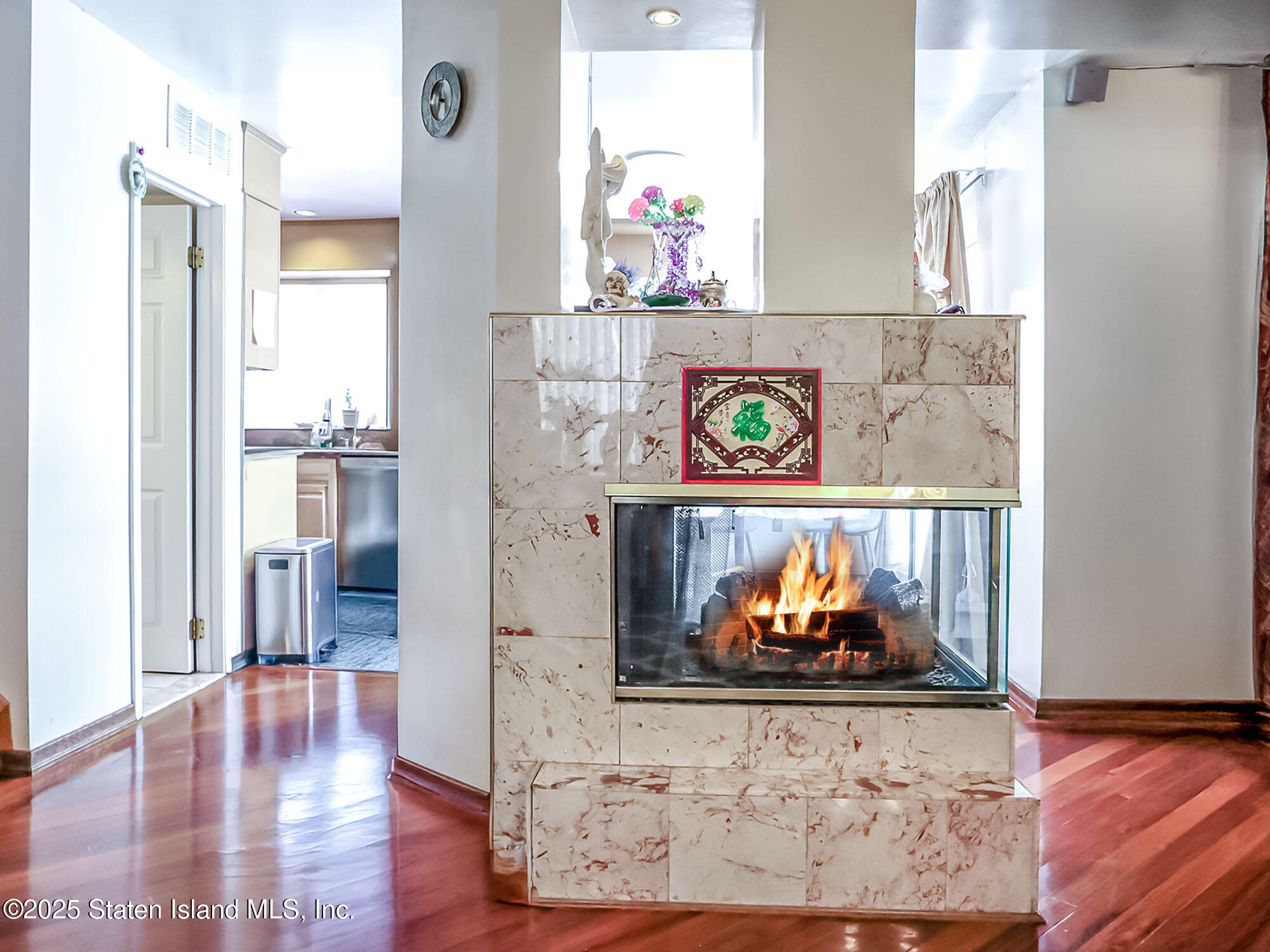 45 Fairlawn Loop Staten Island, NY 10308 - Photo 10 of 49 a view of a hallway with wooden floor and a stove