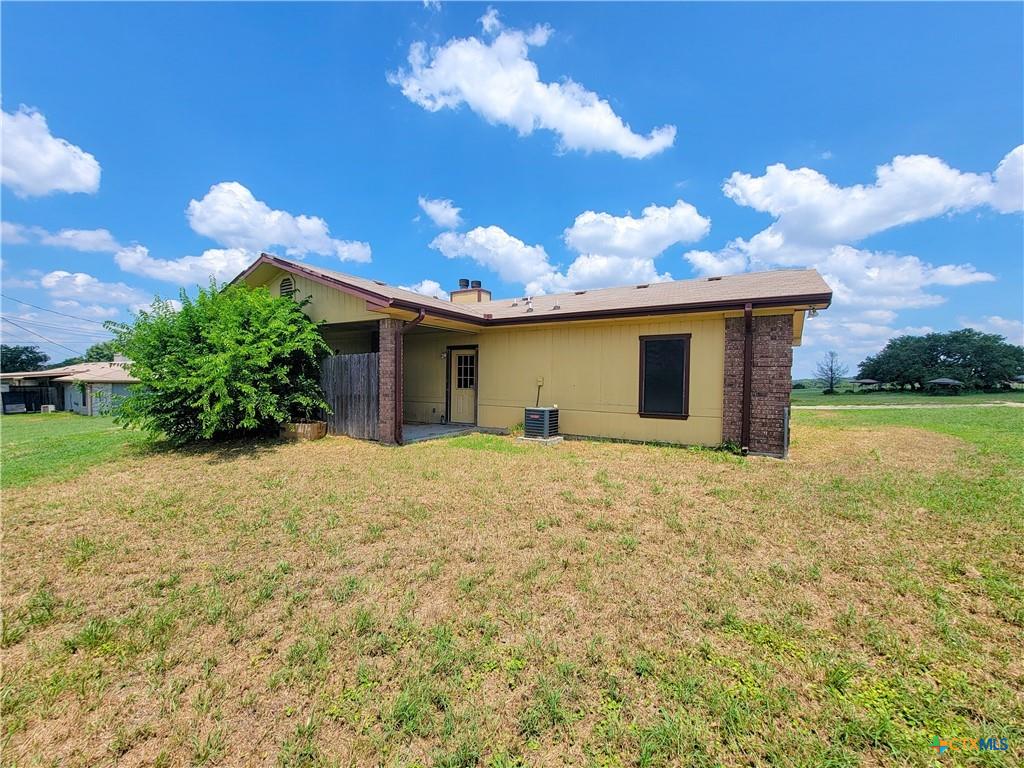 10413 Trimmier Road Killeen, TX 76542 - Photo 2 of 8 A modest dwelling with brick accents and an inviting backyard space for outdoor enjoyment.