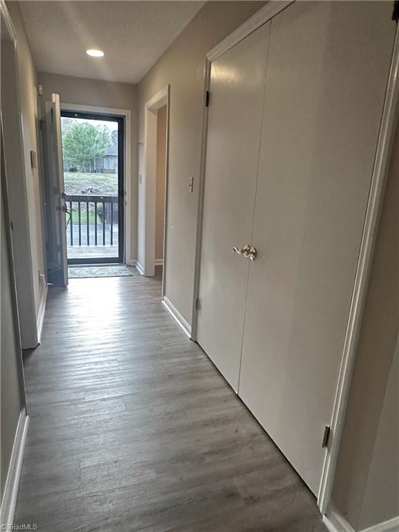 222 Ridge Forest Court Winston-Salem, NC 27104 - Photo 11 of 29 Hallway showing front door and laundry closet
