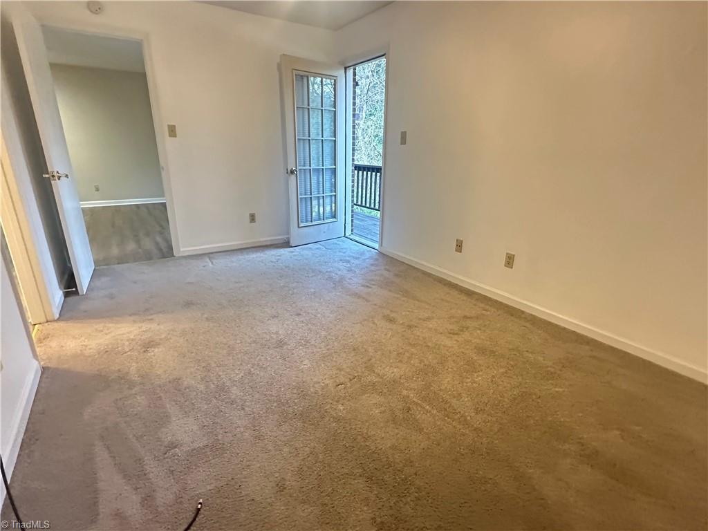 222 Ridge Forest Court Winston-Salem, NC 27104 - Photo 15 of 29 2nd bedroom with door to back deck