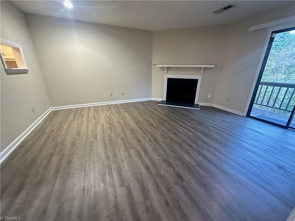 222 Ridge Forest Court Winston-Salem, NC 27104 - Photo 9 of 29 Living room with wood burning fireplace