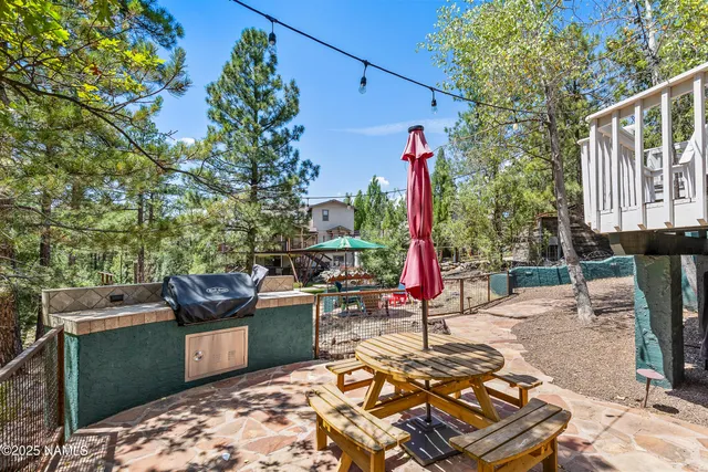 a view of a backyard with sitting area