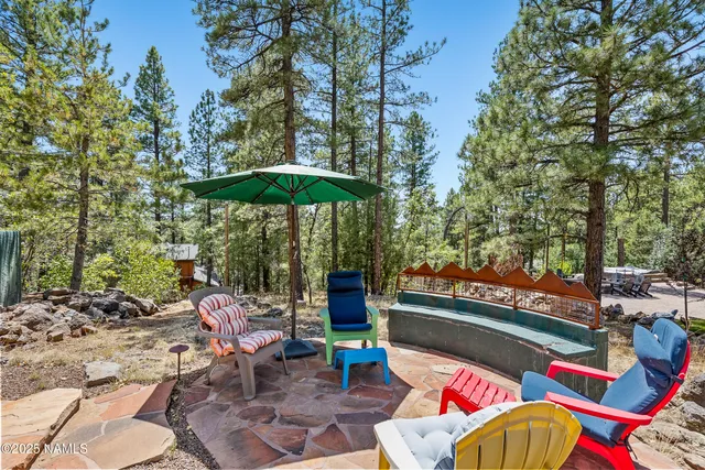 a view of a chairs and table in the patio