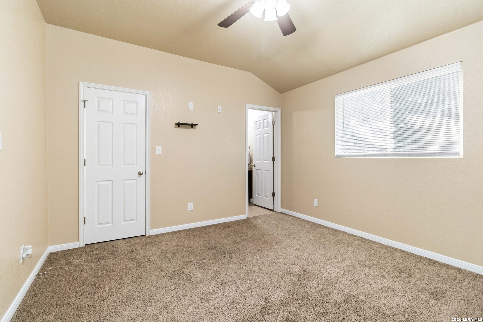 8711 8th Street, Unit 1 Converse, TX 78109 - Photo 12 of 25 an empty room with chandelier fan
