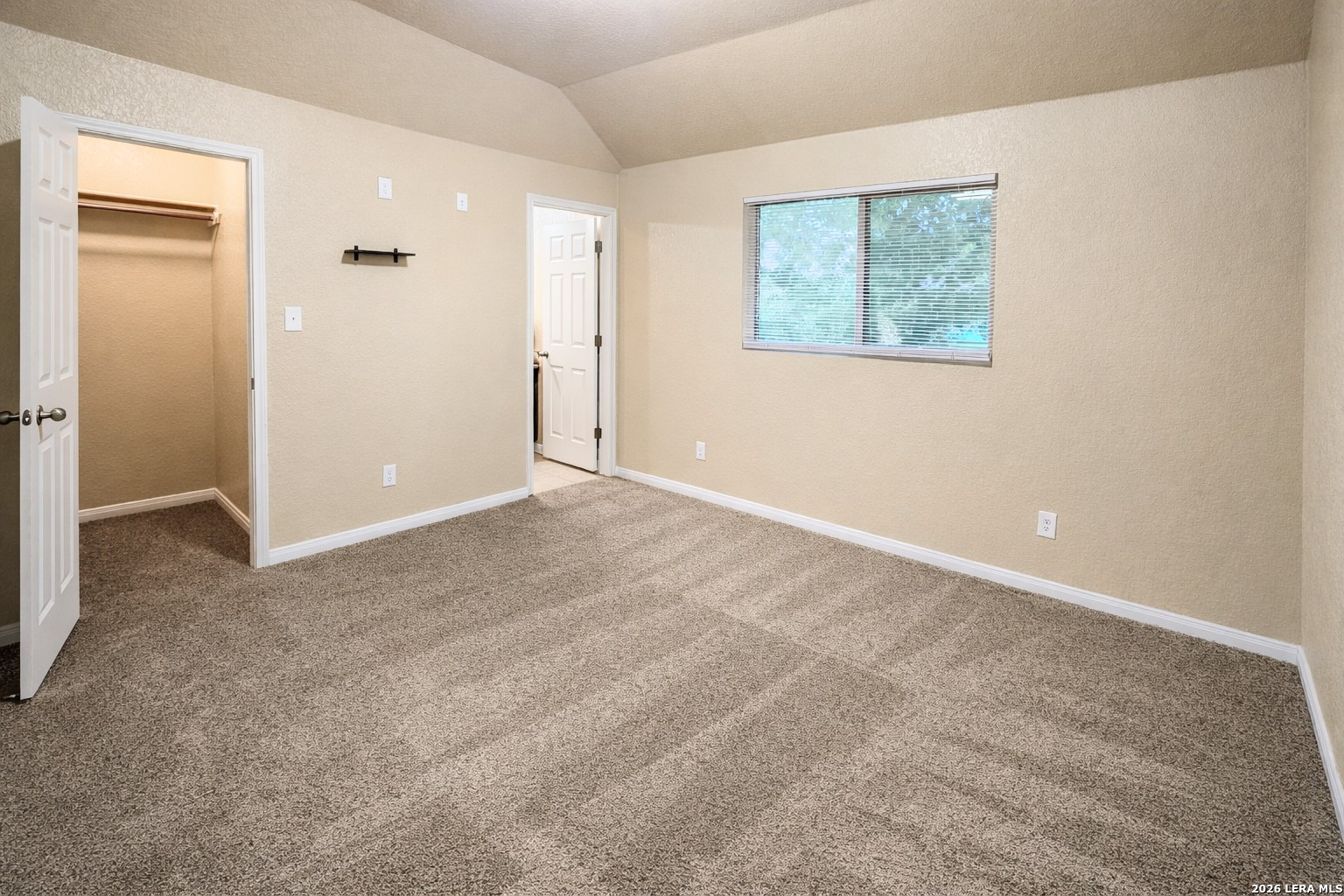 8711 8th Street, Unit 1 Converse, TX 78109 - Photo 13 of 25 an empty room with windows and closet