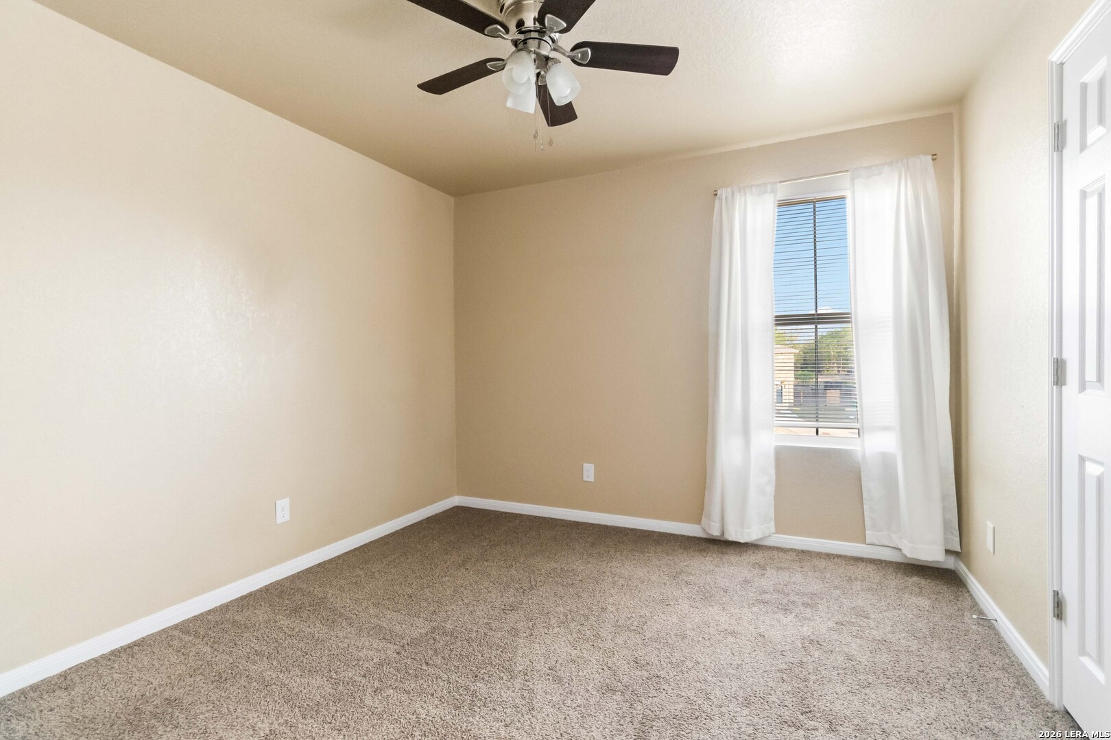 8711 8th Street, Unit 1 Converse, TX 78109 - Photo 18 of 25 a view of an empty room with a window