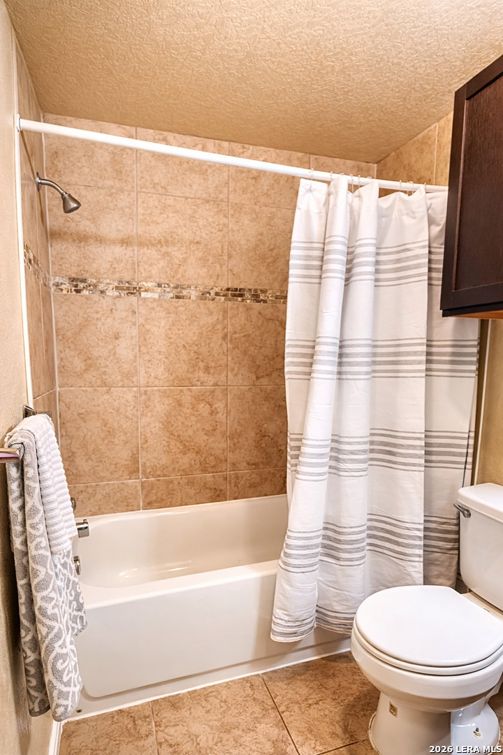 8711 8th Street, Unit 1 Converse, TX 78109 - Photo 20 of 25 a bathroom with a toilet and a shower