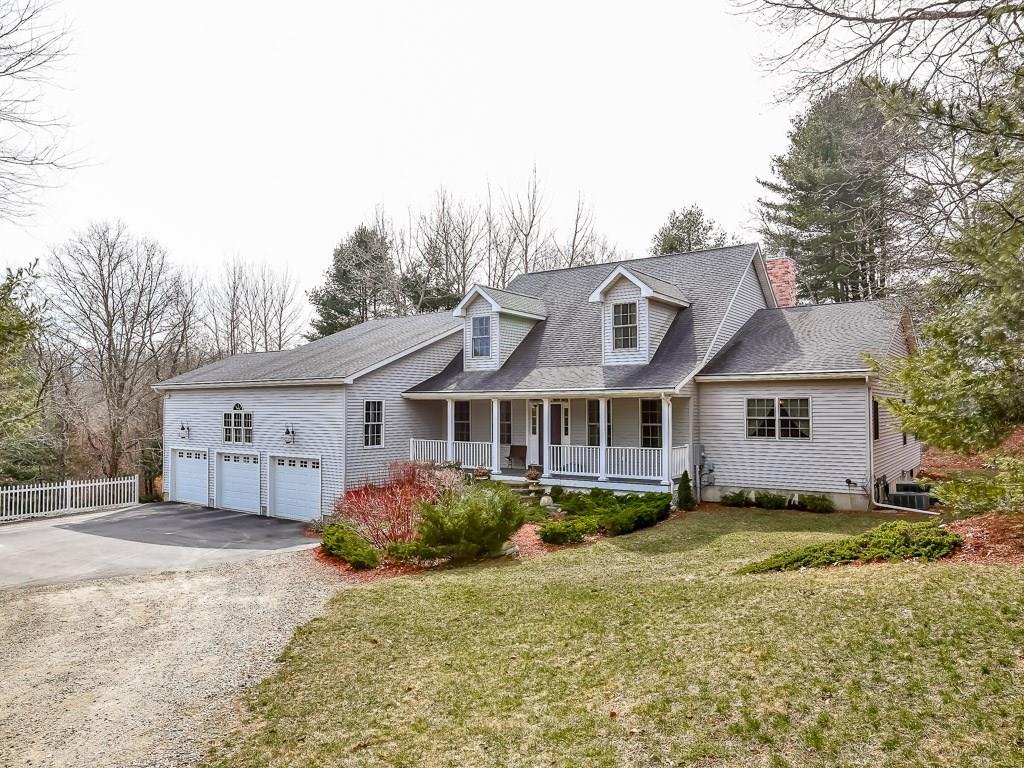 65 Middle Road Preston, CT 06365 - Photo 1 of 1 a front view of a house with a yard and garage