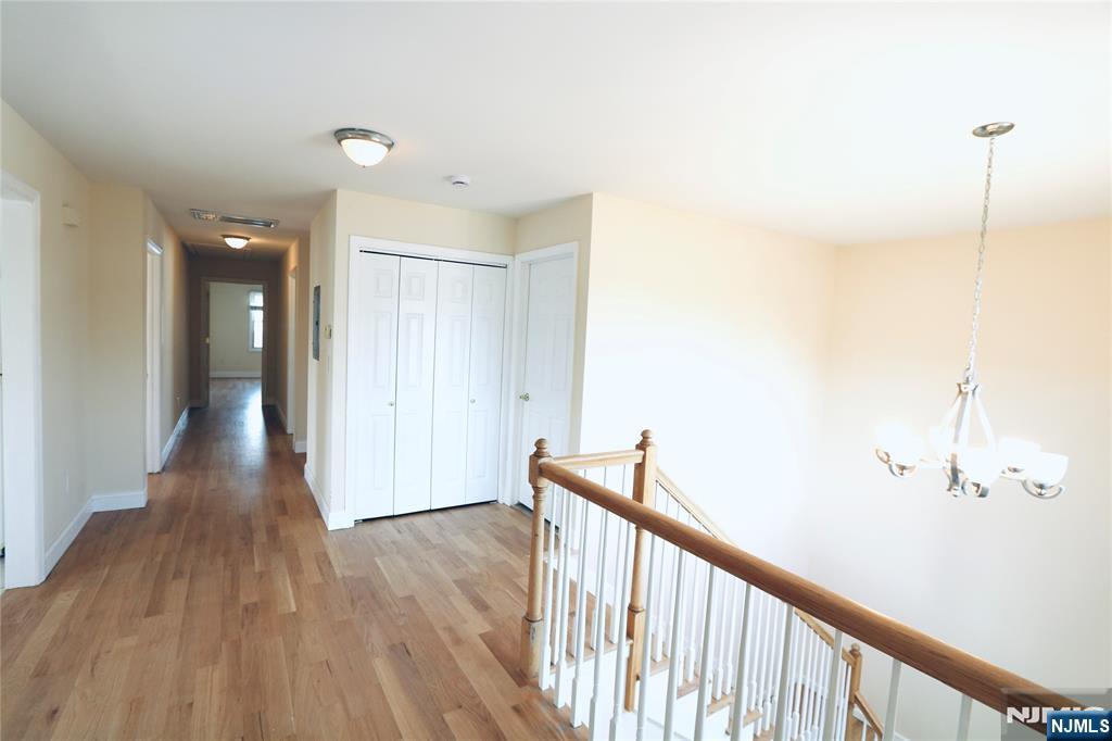 23 Main Avenue Wallington, NJ 07057 - Photo 11 of 29 a view of a hallway with wooden floor