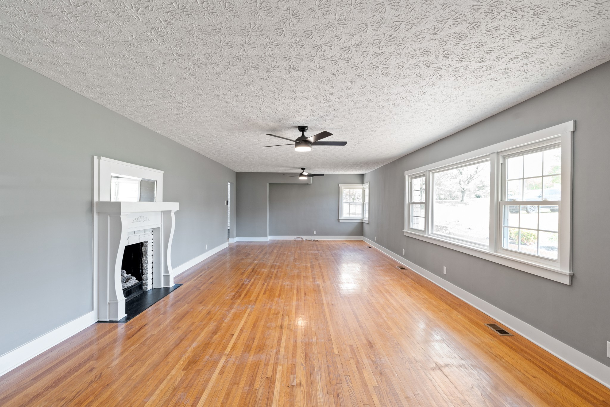 1503 5th Avenue West Springfield, TN 37172 - Photo 10 of 43 wooden floor in an empty room with a fireplace