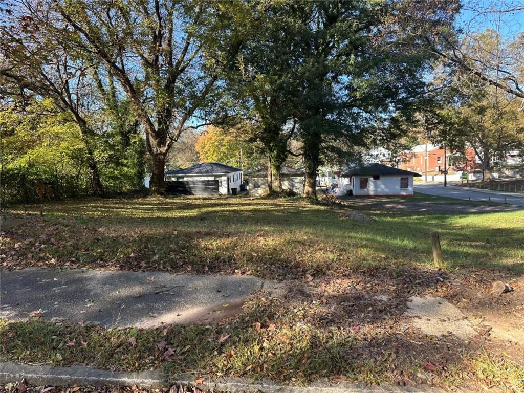 0 Windsor Street Southwest Atlanta, GA 30315 - Photo 2 of 3 a view of a yard with a table and chairs and a large tree