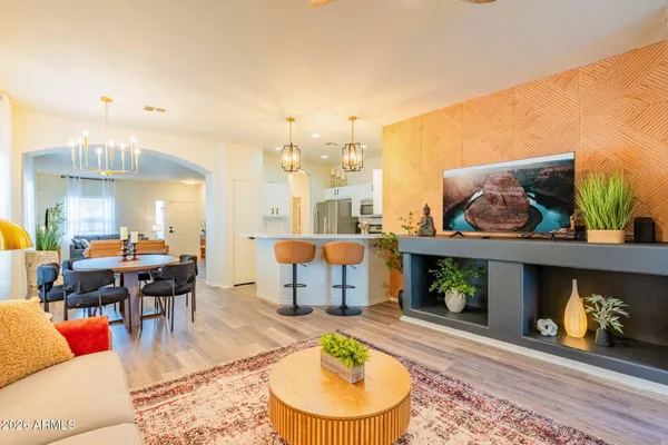 a living room with furniture and a fireplace