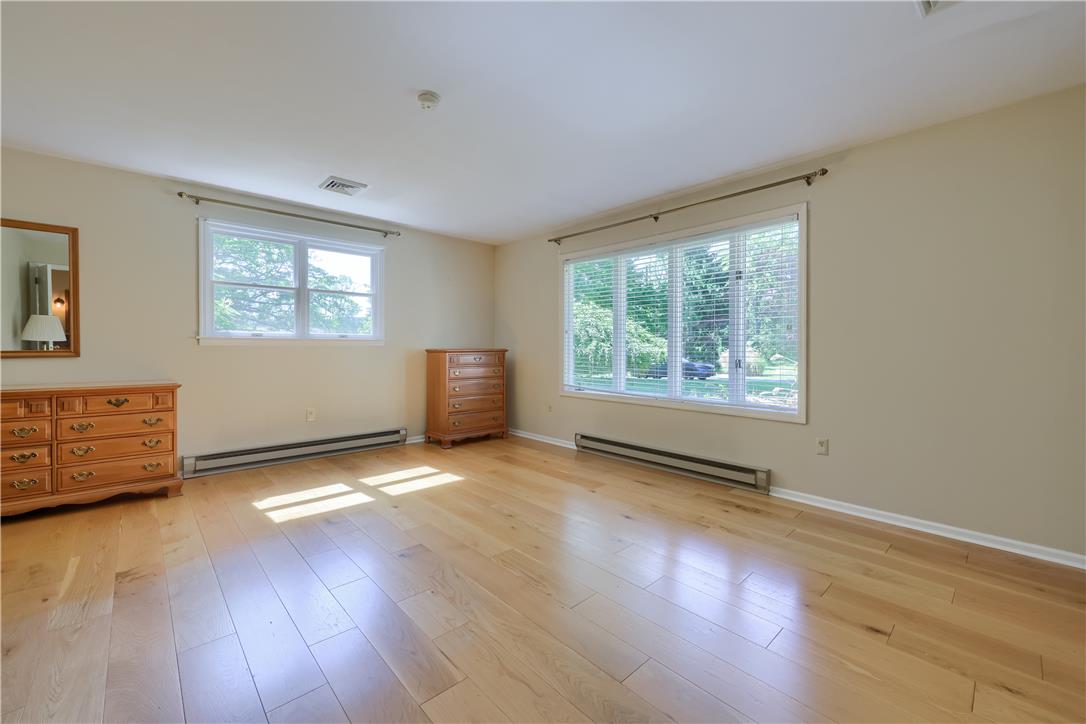 Coldsprings Rd Union Pottstown, PA 19465 - Photo 61 of 71 Natural light floods this generously proportioned room, highlighting the warm wood flooring and ample wall space.