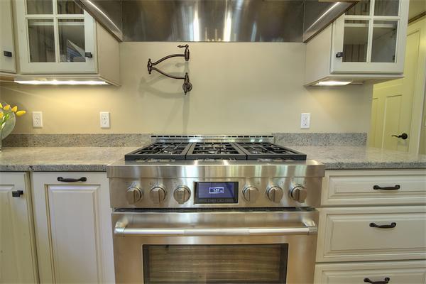 410 High Plain Road Andover, MA 01810 - Photo 20 of 30 a stove top oven sitting inside of a kitchen