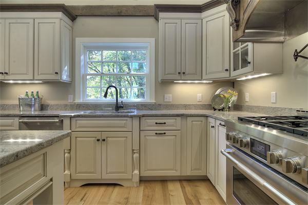 410 High Plain Road Andover, MA 01810 - Photo 22 of 30 a kitchen with stainless steel appliances granite countertop a sink stove and cabinets