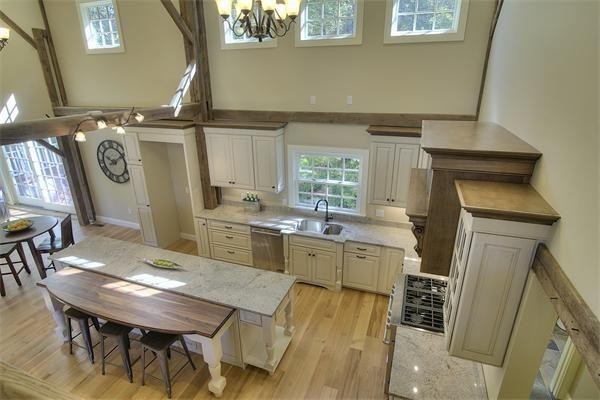 410 High Plain Road Andover, MA 01810 - Photo 8 of 30 a kitchen with a table chairs and a refrigerator