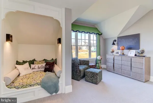 a bedroom with furniture and a window