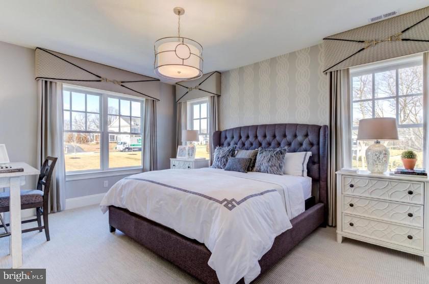 718 South Waterloo Road Devon, PA 19333 - Photo 17 of 25 a spacious bedroom with a bed and window with chair