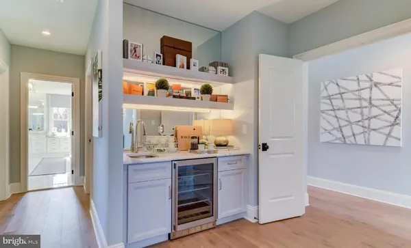 a kitchen with stainless steel appliances a refrigerator and cabinets