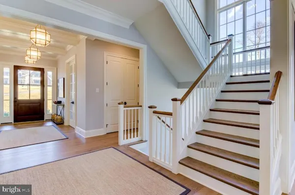 a view of staircase with white walls and windows