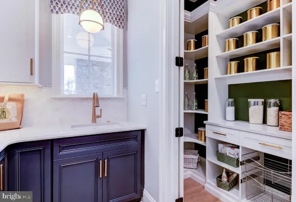 a kitchen with a cabinets and window