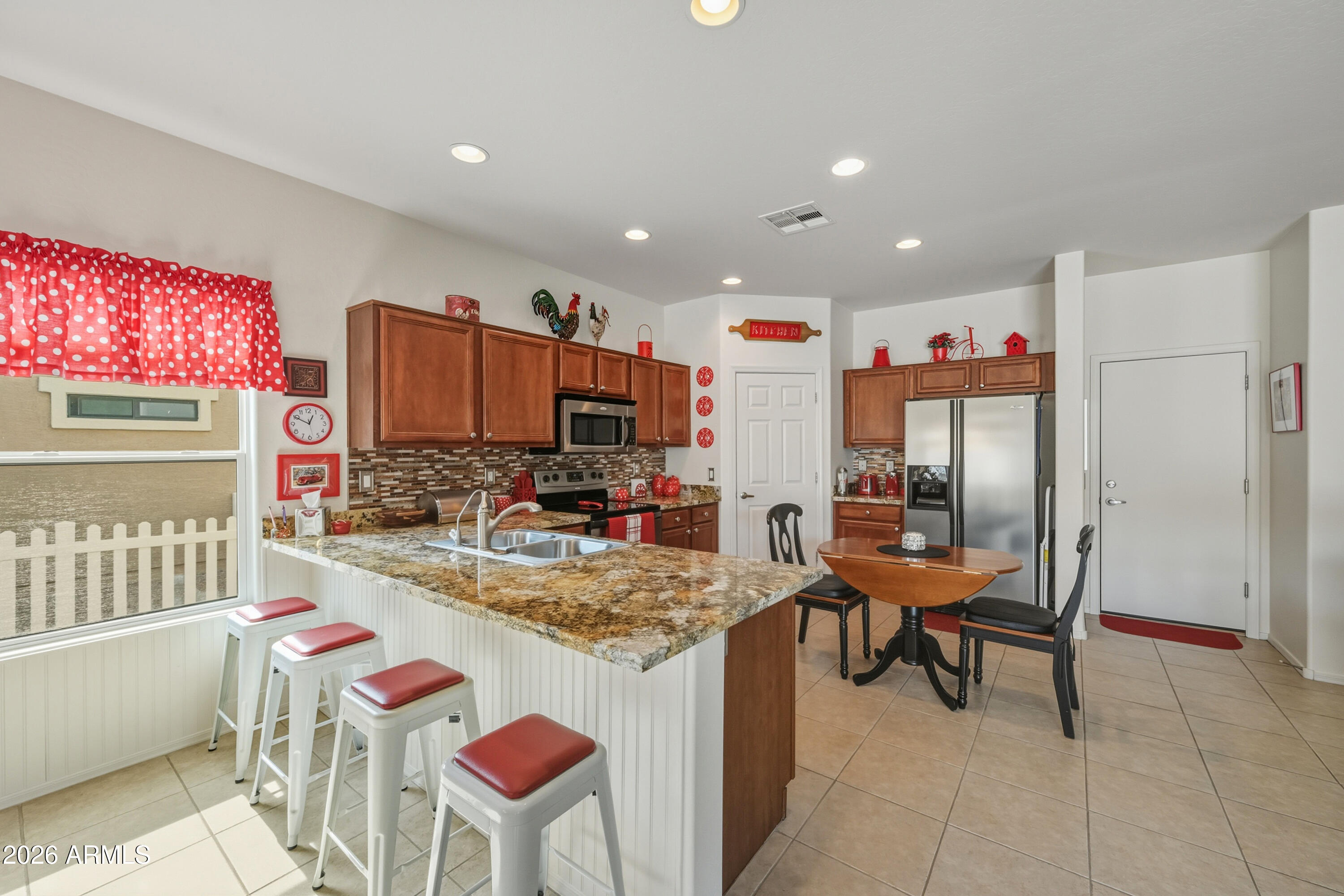 2101 South Meridian Road, Unit 198 Apache Junction, AZ 85120 - Photo 10 of 29 a very nice looking dining room with a computer on a table and chairs