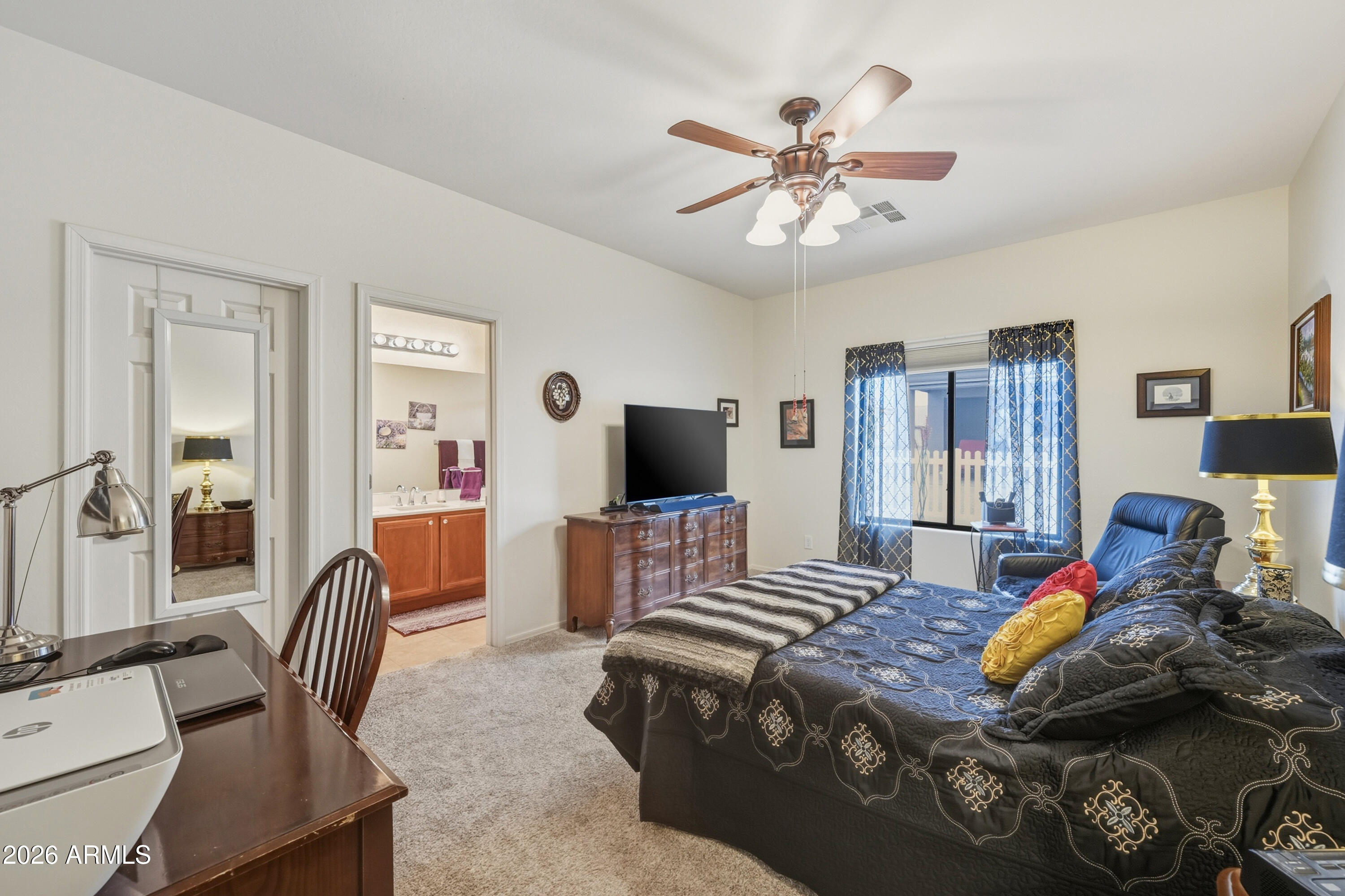 2101 South Meridian Road, Unit 198 Apache Junction, AZ 85120 - Photo 15 of 29 a bedroom with a bed and a flat screen tv