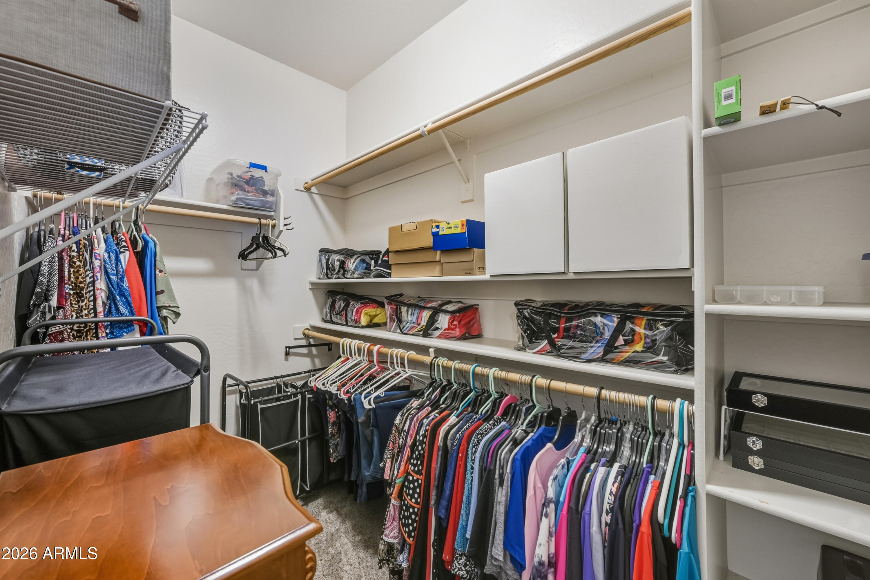 2101 South Meridian Road, Unit 198 Apache Junction, AZ 85120 - Photo 17 of 29 a view of walk in closet with clothes and shoes