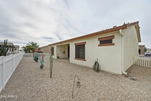 a view of a house with backyard and porch