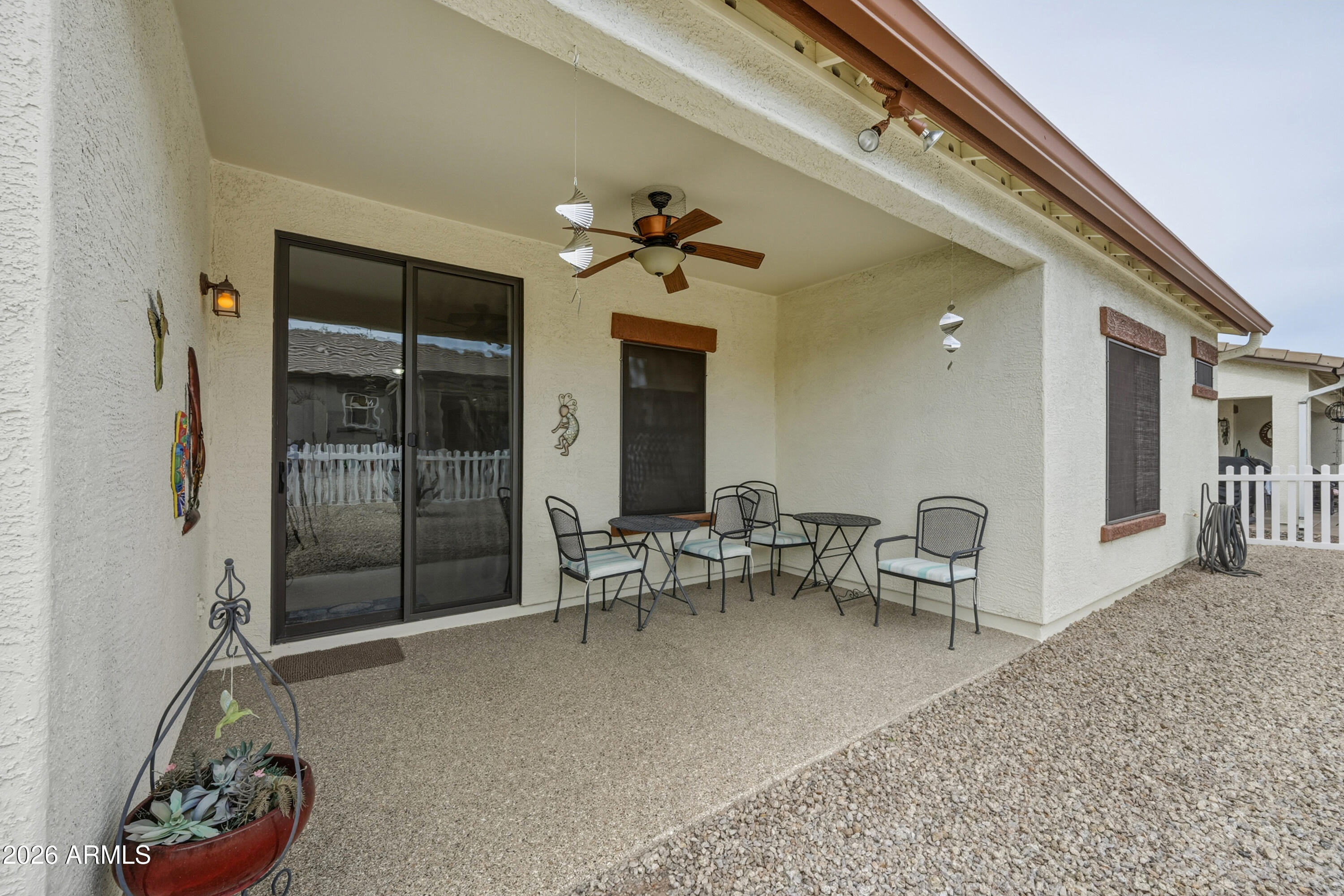 2101 South Meridian Road, Unit 198 Apache Junction, AZ 85120 - Photo 27 of 29 a living room with furniture and a chandelier