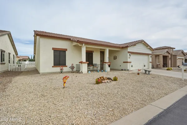 a view of a hallway with workspace and a window