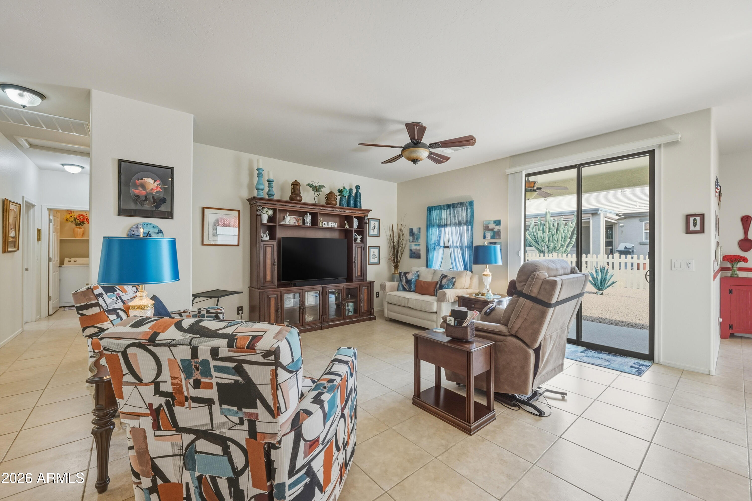 2101 South Meridian Road, Unit 198 Apache Junction, AZ 85120 - Photo 5 of 29 a living room with furniture and a flat screen tv