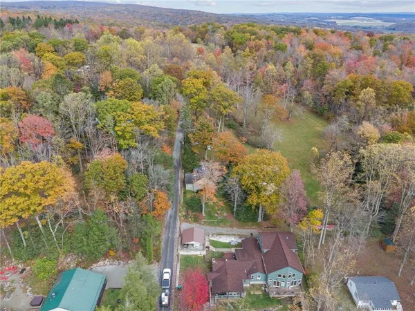 an aerial view of residential houses with outdoor space