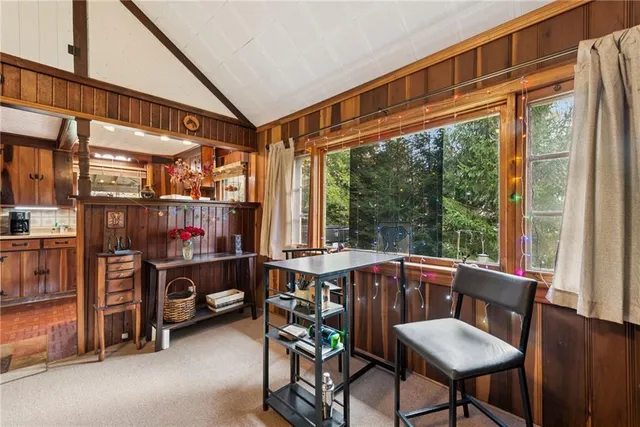 a view of a dining room with furniture window and outside view