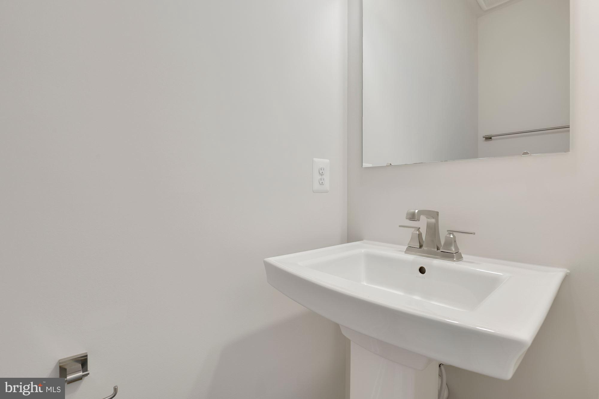 221 Edwin Road Frederick, MD 21702 - Photo 14 of 36 a white sink sitting next to a white sink