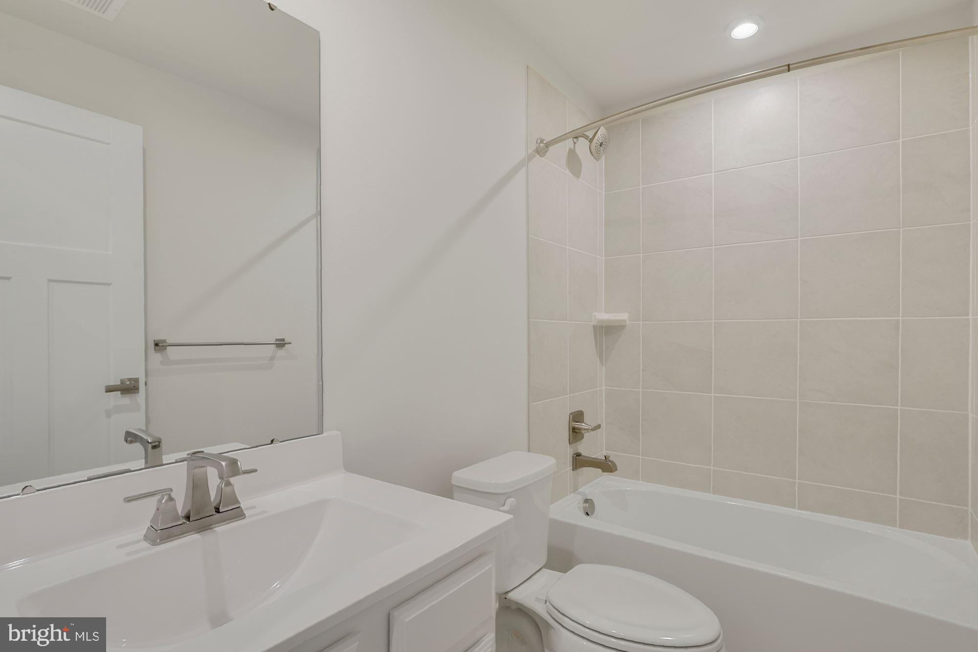 221 Edwin Road Frederick, MD 21702 - Photo 16 of 36 a bathroom with a sink toilet and shower