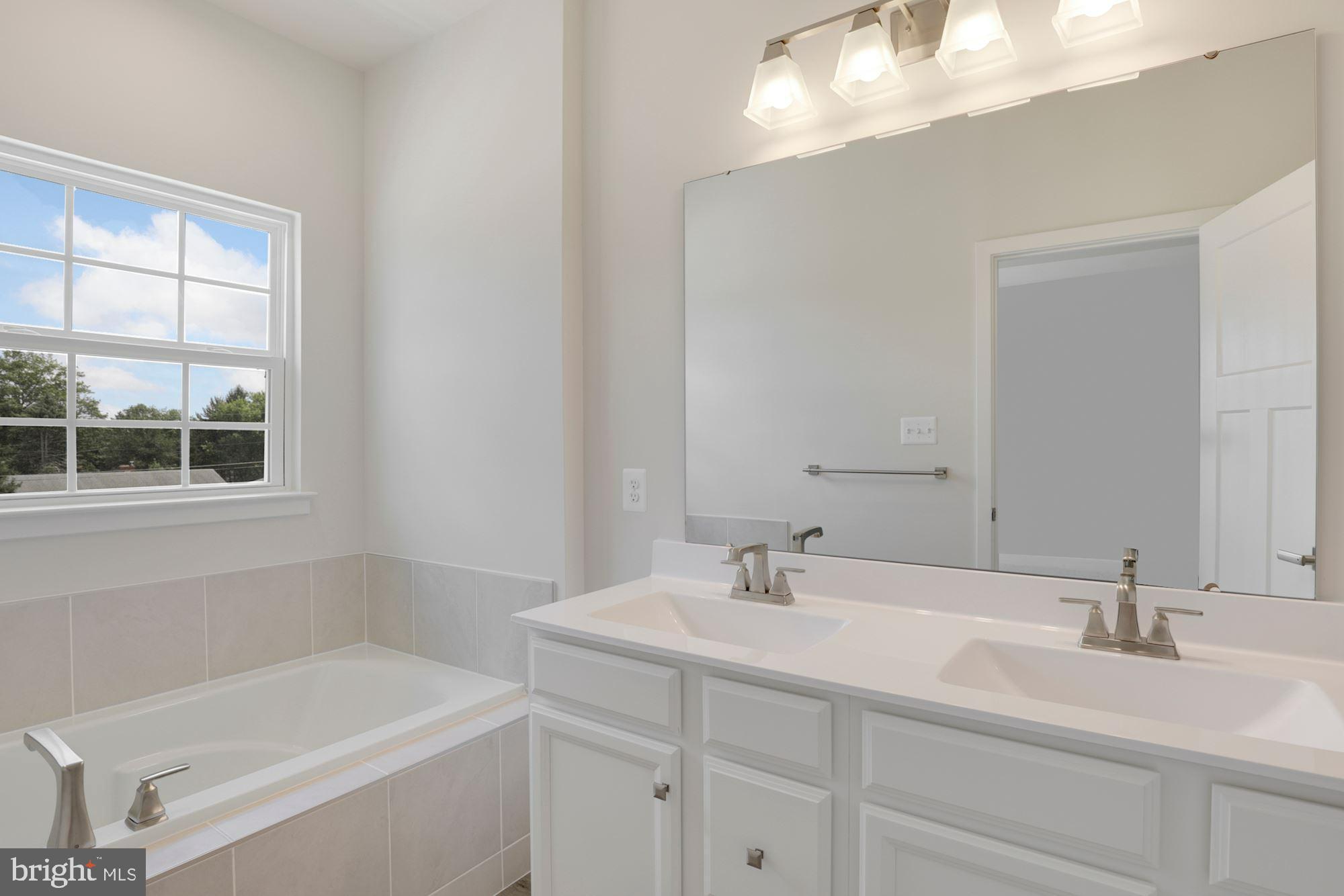 221 Edwin Road Frederick, MD 21702 - Photo 26 of 36 a bathroom with a sink and a bathtub